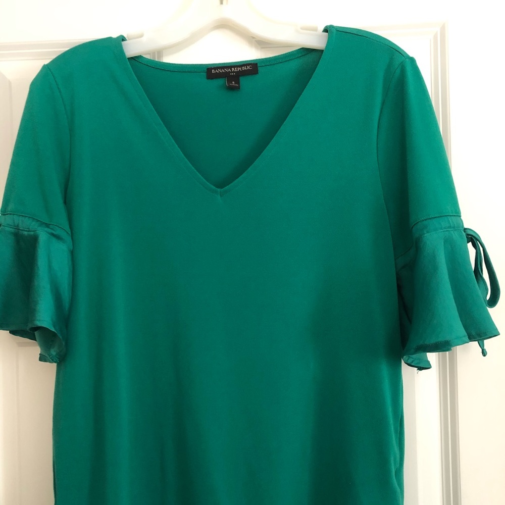 Green blouse with mid-length bell sleeves
